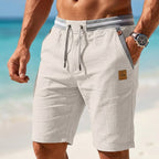 Man wearing Breezy Bermuda Shorts - casual summer lifestyle by Sistrow London